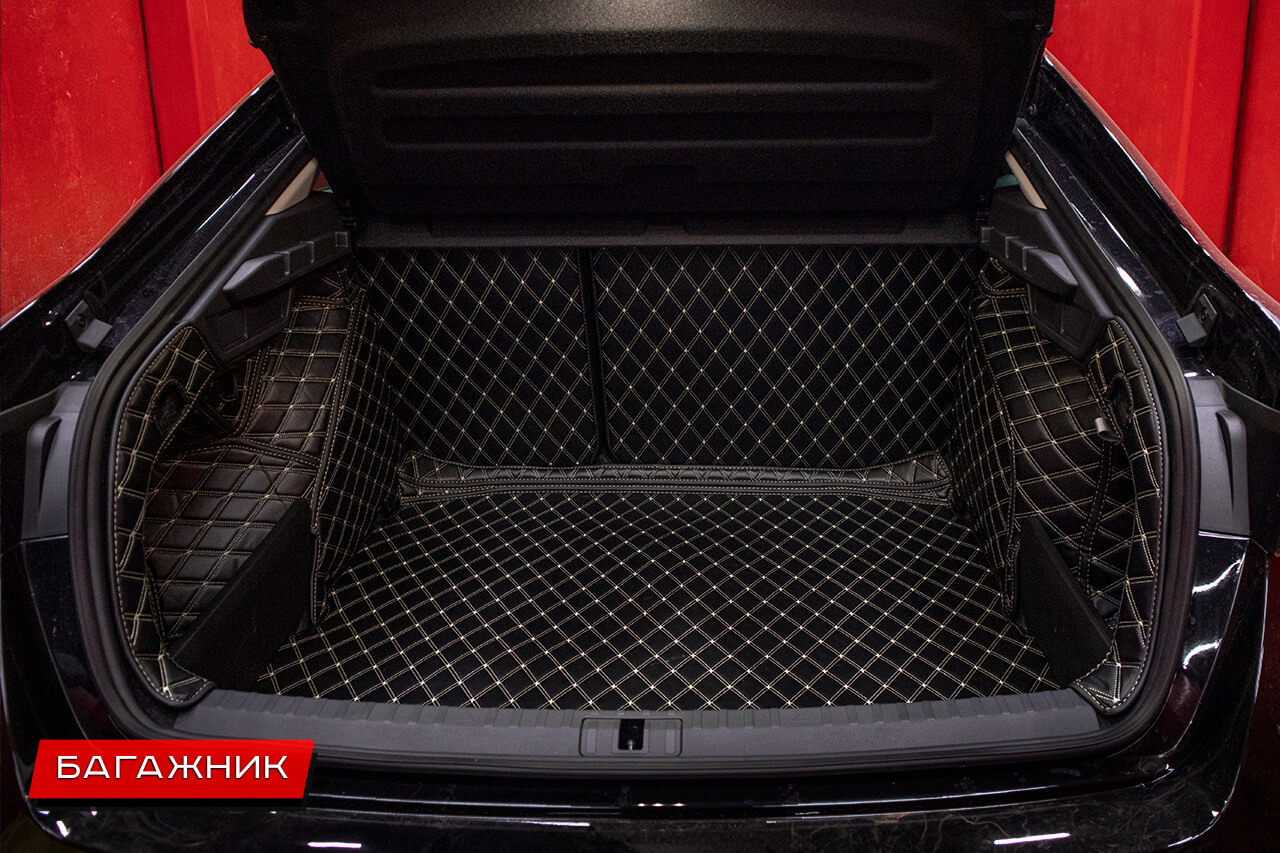 Коврики в багажник Skoda Octavia закрывают колесные арки и спинки сидений
